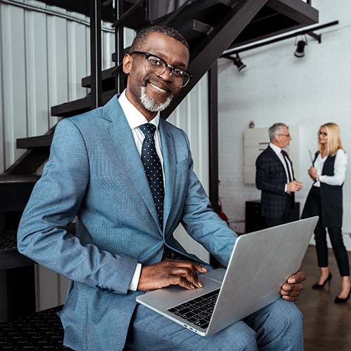 selective-focus-of-cheerful-african-american-busin-2023-11-27-05-14-47-utc